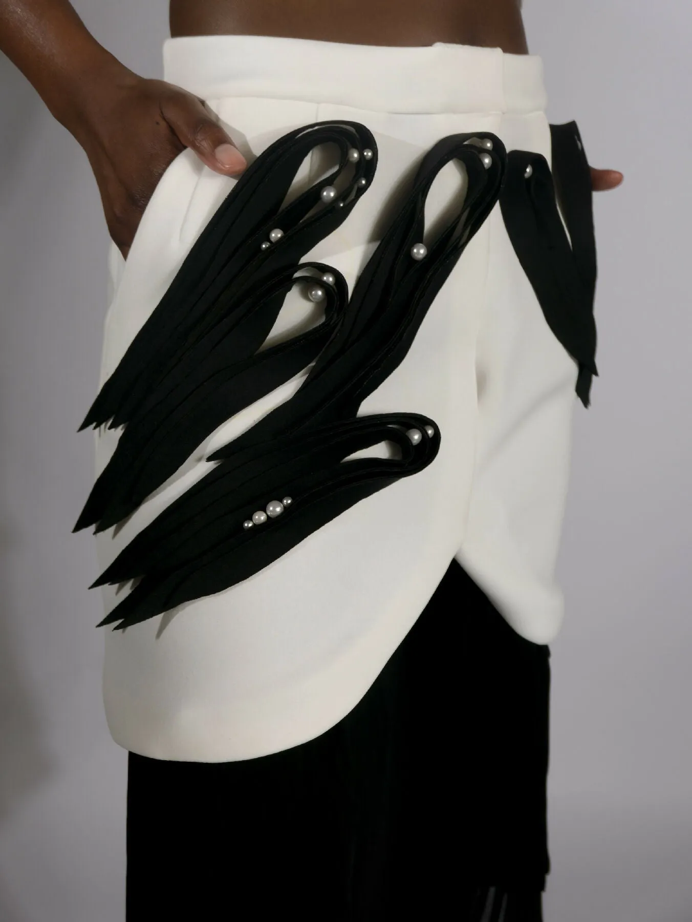 ARGO, asymmetrical pleated skirt with neoprene quilling-like application